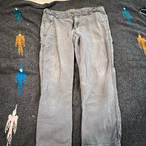Men’s “distressed” Carhartt work pants.
